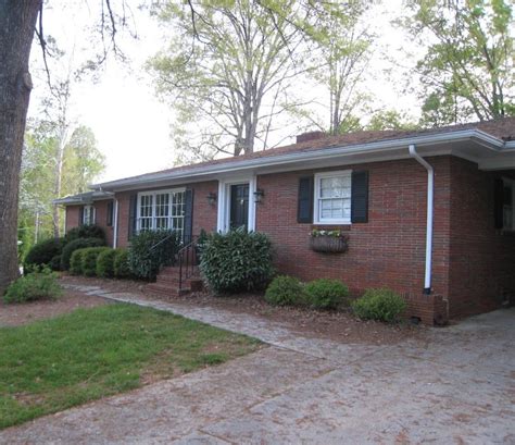 Giving a Basic Red-Brick Ranch Modern Curb Appeal - Hooked on Houses