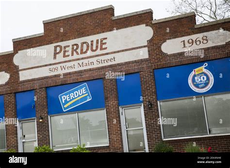 A logo sign outside of a Perdue Farms poultry processing plant in ...