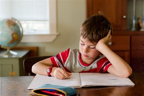 "Little Boy Doing His Homework" by Stocksy Contributor "Lea Jones ...