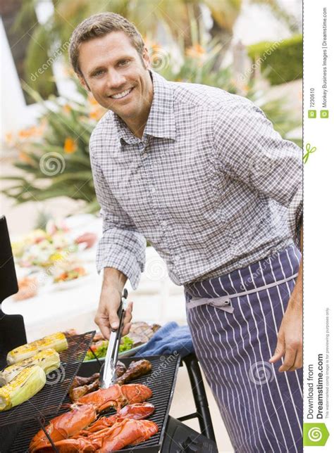 Man Barbequing In A Garden. Father Cooking Lobster On Barbeque # ...