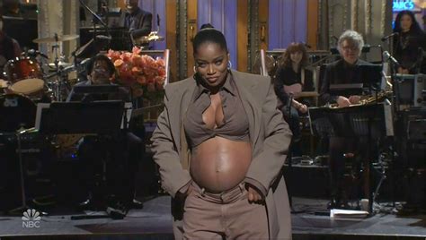 Keke Palmer reveals she's pregnant on SNL and shows off her baby bump in shocking live TV moment ...