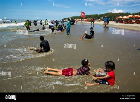 Tourists at the Cox’s Bazar sea beach, the longest unbroken sea beach ...