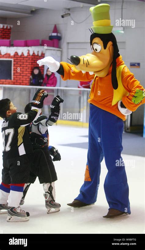 Goofy interacts with kids at a press conference for the ice show ...