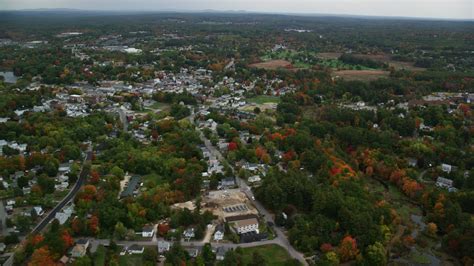 5.5K stock footage aerial video flying by homes, downtown area ...