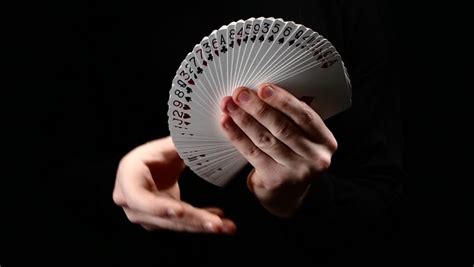 Talanted Magician Showing His Trick With Usual Cards, Like Fan On Black ...