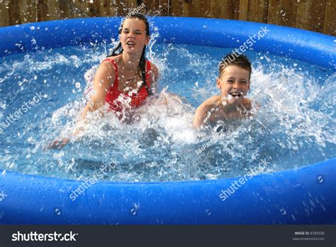 Two Kids Splashing In Pool. Stock Photo 8780590 : Shutterstock