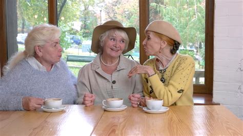 Three senior women at table. Old ladies in cafe talking. Conversation of good friends. Stock ...