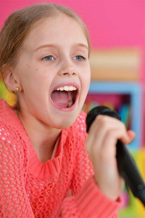 Little Girl Singing with Microphone Stock Image - Image of tenderness ...