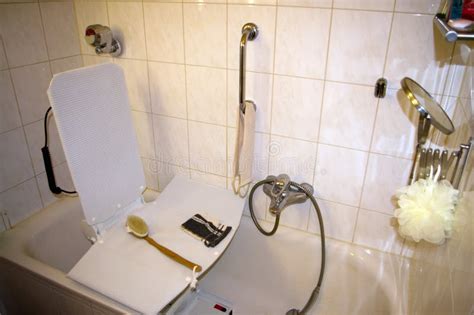 Bath Lift for the Use of the Bathtub by Disabled People. Stock Photo - Image of plaster, help ...