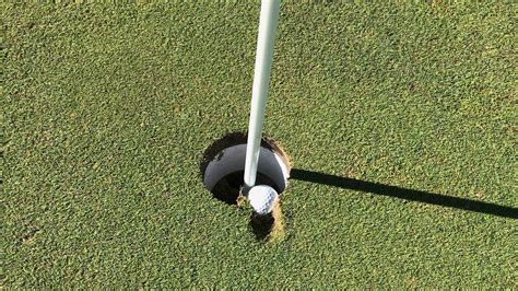 Is this golf ball embedded in the cup a hole-in-one? Here's what we learned