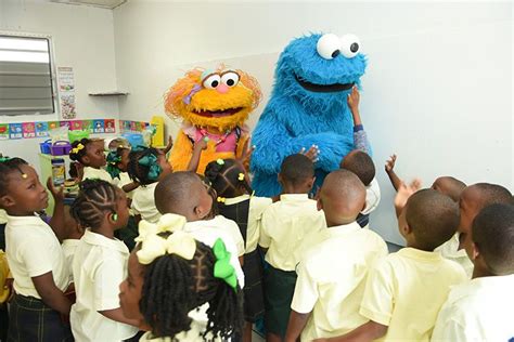 Sesame characters, hugs and school supplies bring back-to-school cheer to Enid Capron Primary