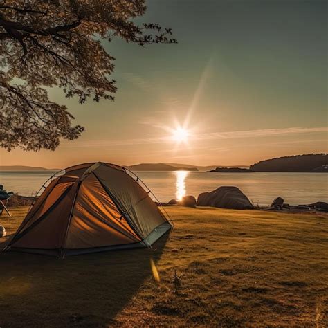 Premium AI Image | Camping tent on a lake shore at sunset camping in nature