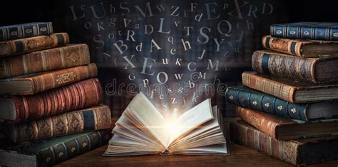 Old Book with Flying Letters and Magic Light on the Background of the Bookshelf in the Library ...