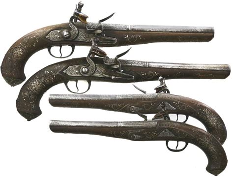 Pair of flintlock officers' pistols with engraved silver mounts, 1700s ...