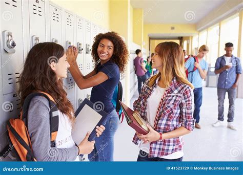 Group Of Female High School Students Talking By Lockers Stock Photo ...