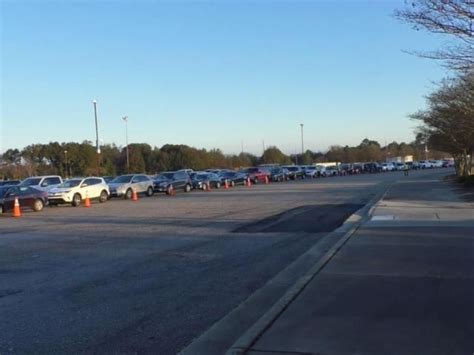 Hundreds wait for a COVID-19 vaccine at Fayetteville's Crown Complex