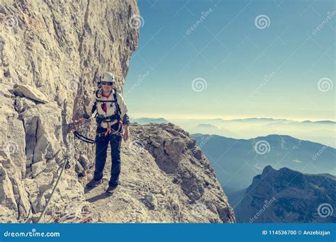 Happy Female Mountaineer Climbing Via Ferrata. Editorial Image - Image ...