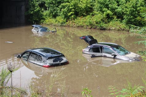 Flooding in Worcester buries 4 cars underwater on Route 20 near Grafton ...