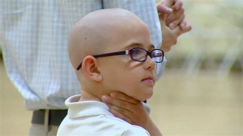 School votes to allow girl with shaved head back in | 9news.com