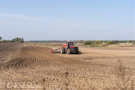 Premium Photo | Tractor on a farmer field