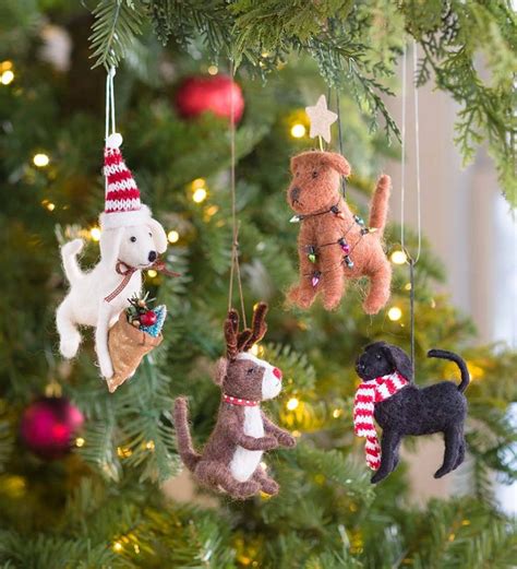 This adorable set of 4 Holiday Dog Ornaments will be festive favorites on your Christmas t ...