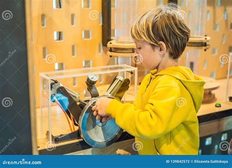 Smart Boy Scientist Making Physical Experiments In The Laboratory. Educational Concept ...