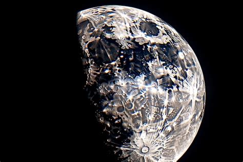 Premium Photo | Closeup shot of the waxing gibbous moon with visible craters and the sea of ...