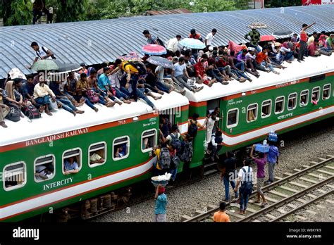 Dhaka, Bangladesh. 09th Aug, 2019. People climb up a train at a railway ...