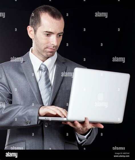 Businessman with laptop Stock Photo - Alamy