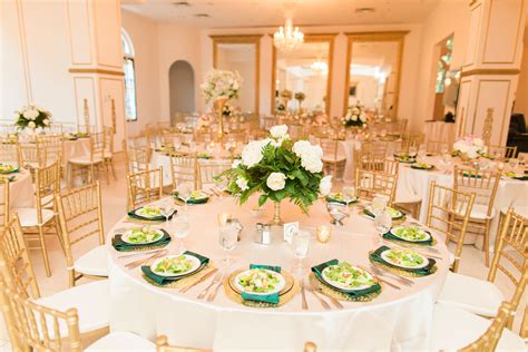 Gold and White Reception Decor With Pops of Emerald Green