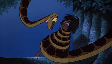 Image - Mowgli is being hypnotized and is wraped up in Kaa the python's ...