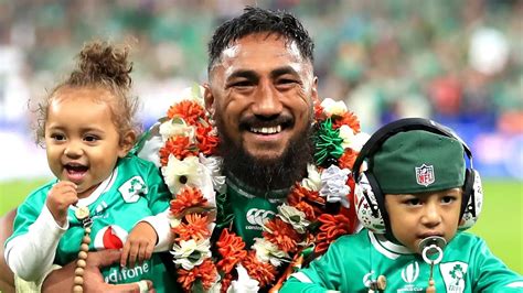 Ireland hero Bundee Aki beams alongside his family after reaching ...