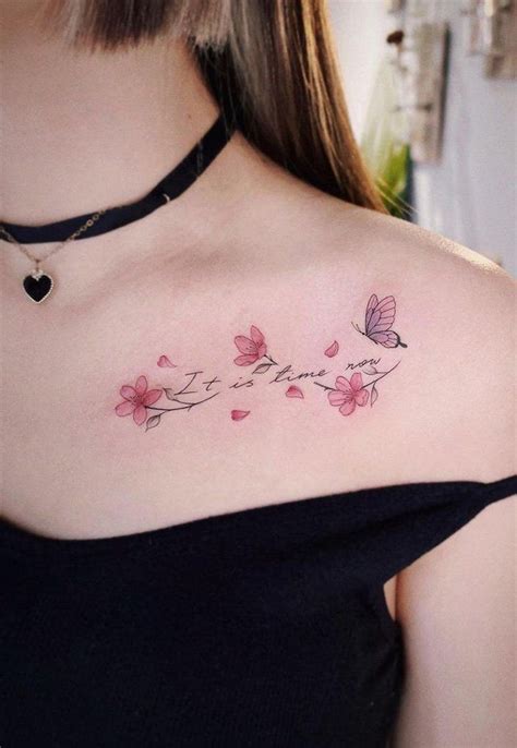 a woman's chest with pink flowers and butterflies on it