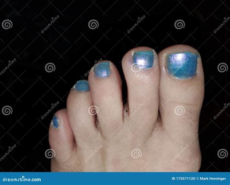 Womans Feet On A Grey Background Royalty-Free Stock Photo | CartoonDealer.com #123038925