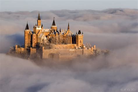 Hohenzollern castle at sunrise on a winter morning in the sea of clouds ...