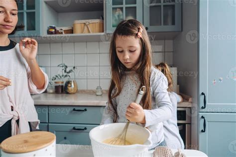 happy family cook together in the kitchen 11340233 Stock Photo at Vecteezy