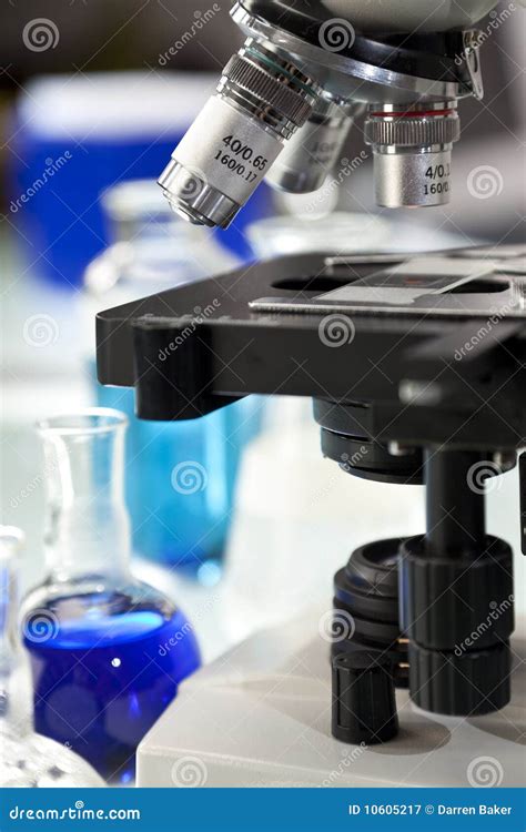 Microscope in a Science Laboratory with Flasks Stock Image - Image of ...