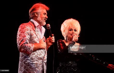 American musicians Kenny Rogers and Dolly Parton perform a duet at ...