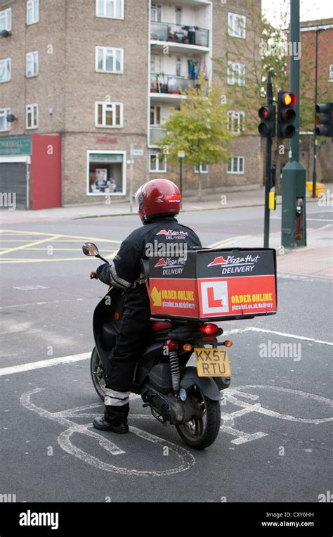 Pizza Hut delivery motorcycle Stock Photo - Alamy