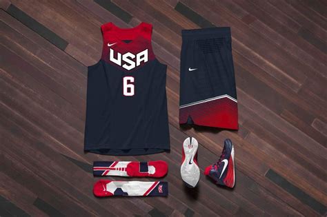 the usa basketball team's uniform and shoes are laid out on a wooden floor