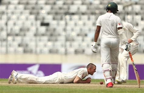 Josh Hazlewood tries to get his bearings after attempting a catch off ...