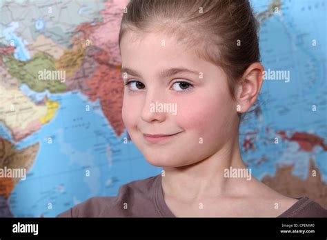 Girl in front of a world map Stock Photo - Alamy