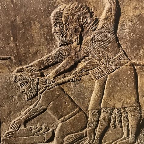 Two Assyrian soldiers forcing Babylonian captive to grind bones of his family, 7th - 6th c. BCE ...