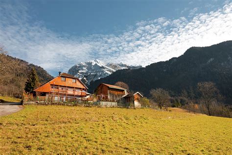 French Alps Chalet Snow Capped Mountains Photograph by Pius Lee