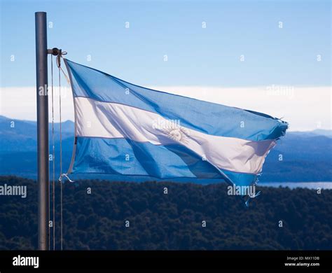 Blue and white national flag of Argentina raised on flagstaff ...