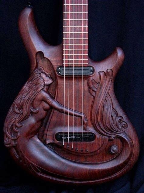 Carved wooden guitar. : r/pics