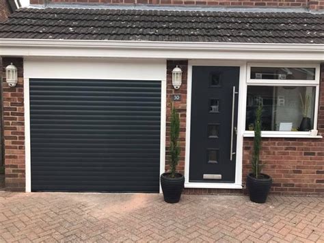 Anthracite grey insulated and remote control roller garage door and ...