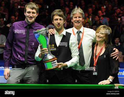 England's Judd Trump celebrates with his family (left to right) brother ...