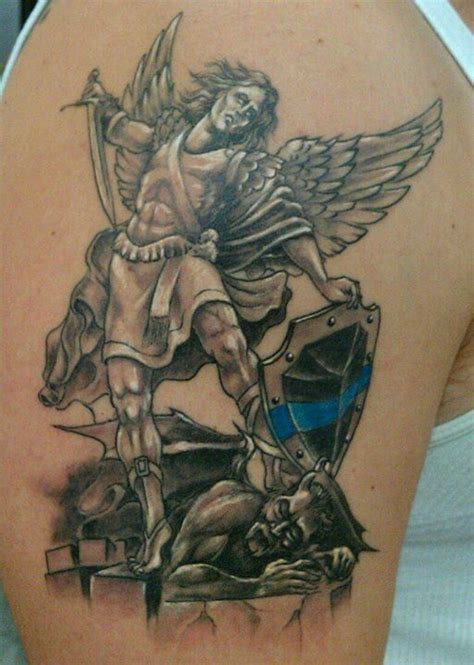 St Michael | Archangel tattoo, Mens shoulder tattoo, St michael tattoo