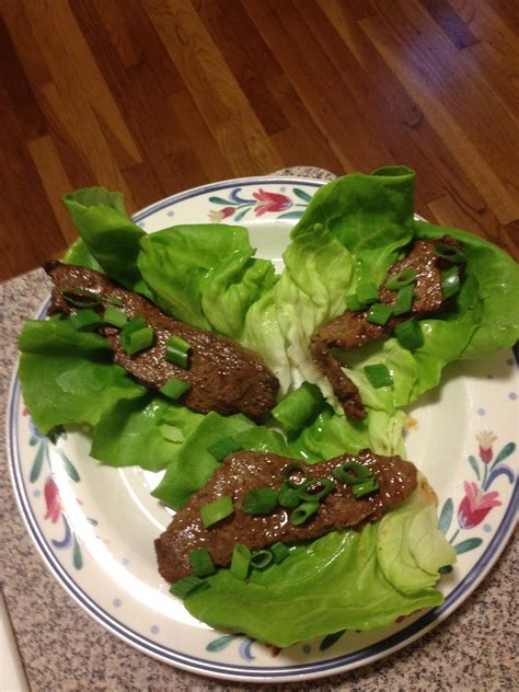 pieces of cooked meat put in boston lettuce to make lettuce wraps and ...